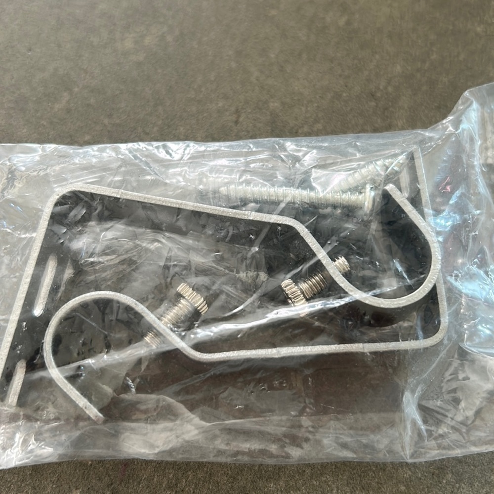 Silver curtain rod brackets.